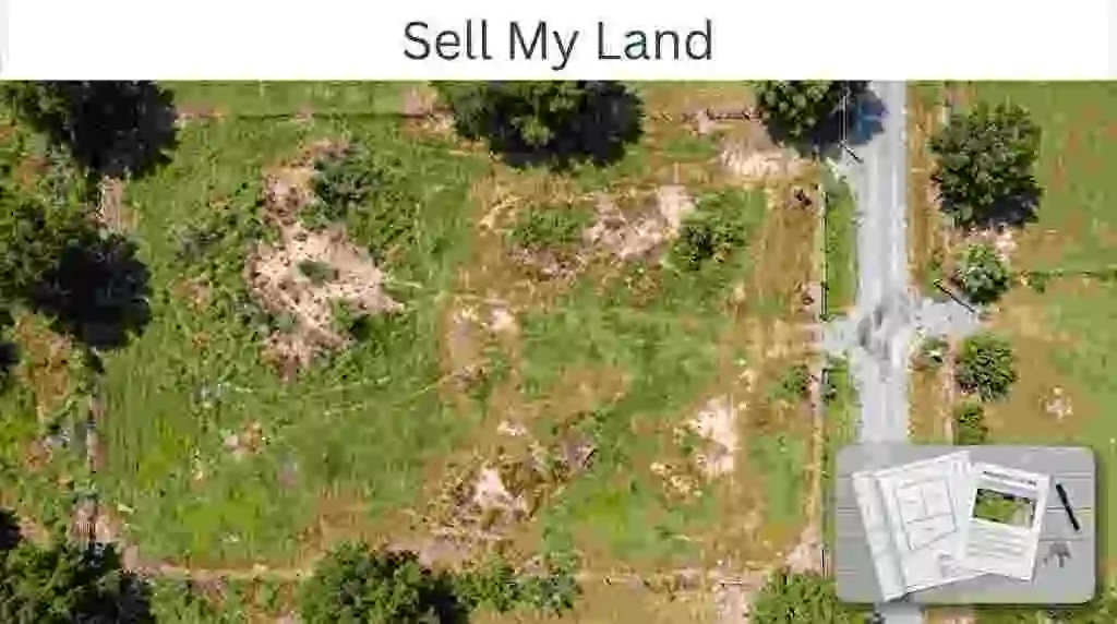 An aerial top-down view of a vacant plot of land with natural green grass, dry earth, visible boundaries, a gravel road, and a desk with a survey map and property listing sheets – Sell My Land- 1