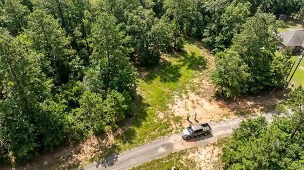 overhead-aerial-view-of-land-inspection-on-vacant-parcel - Sell My Land Fast in Willis -  2